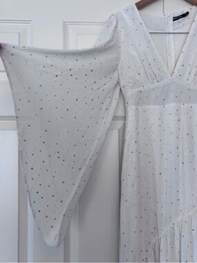 Bohemian white dress with gold stars and bell sleeves